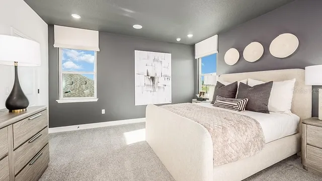 a living room with furniture and a baby crib