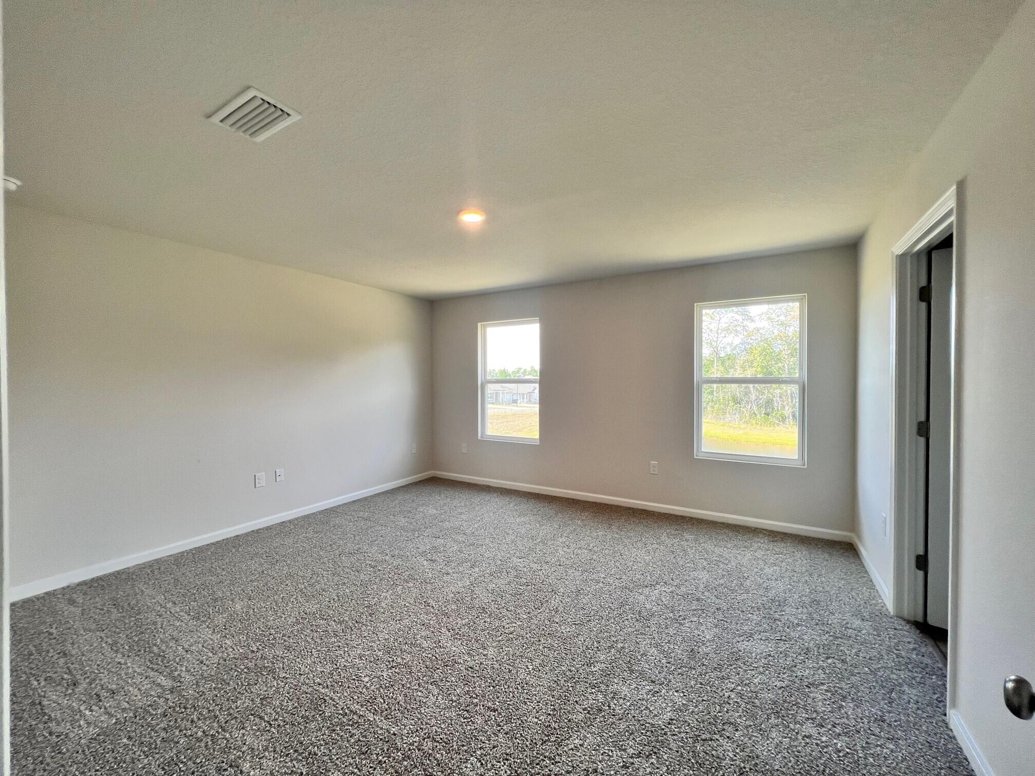 3021 Jane Lane Crestview, FL 32539 - Photo 7 of 16 an empty room with windows