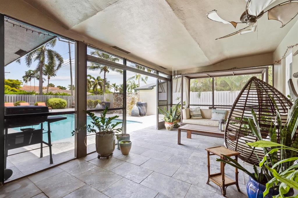 2750 Northeast 45th Street Lighthouse Point, FL 33064 - Photo 15 of 21 a living room with furniture and a floor to ceiling window