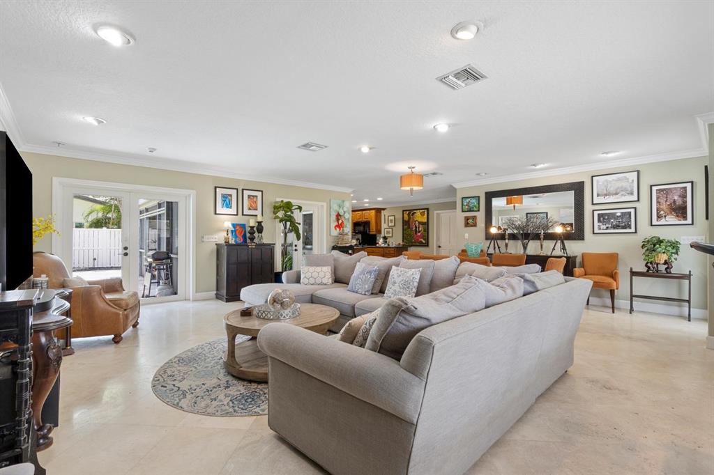 2750 Northeast 45th Street Lighthouse Point, FL 33064 - Photo 3 of 21 a living room with furniture and wooden floor