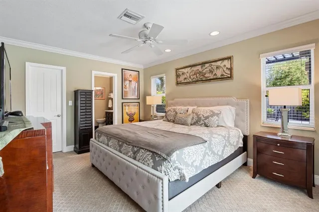 a bedroom with a large bed and a window