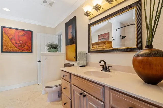 a bathroom with a sink a mirror and a toilet