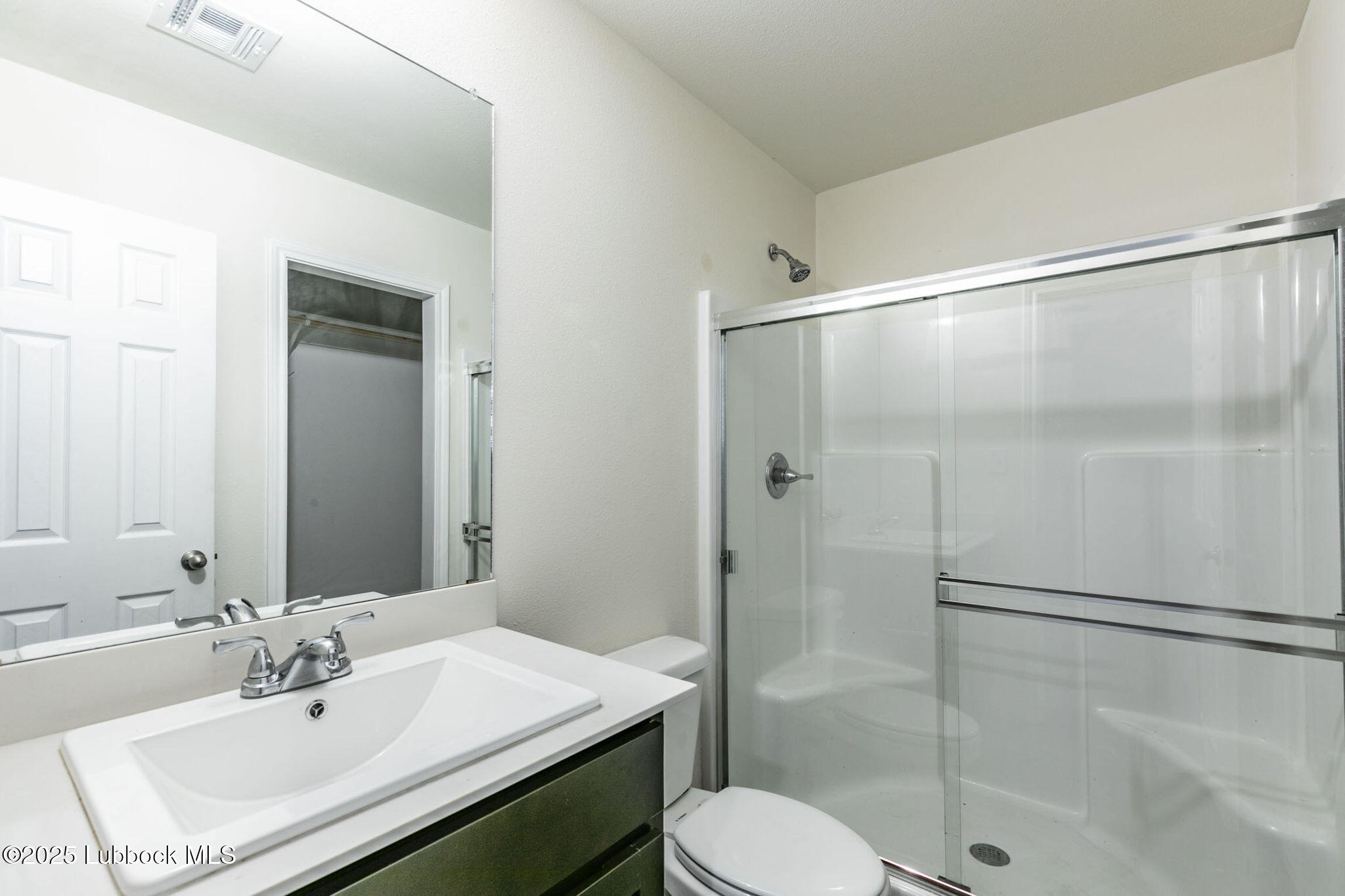 1714 East Cornell Street Lubbock, TX 79403 - Photo 16 of 18 a bathroom with a sink toilet and shower