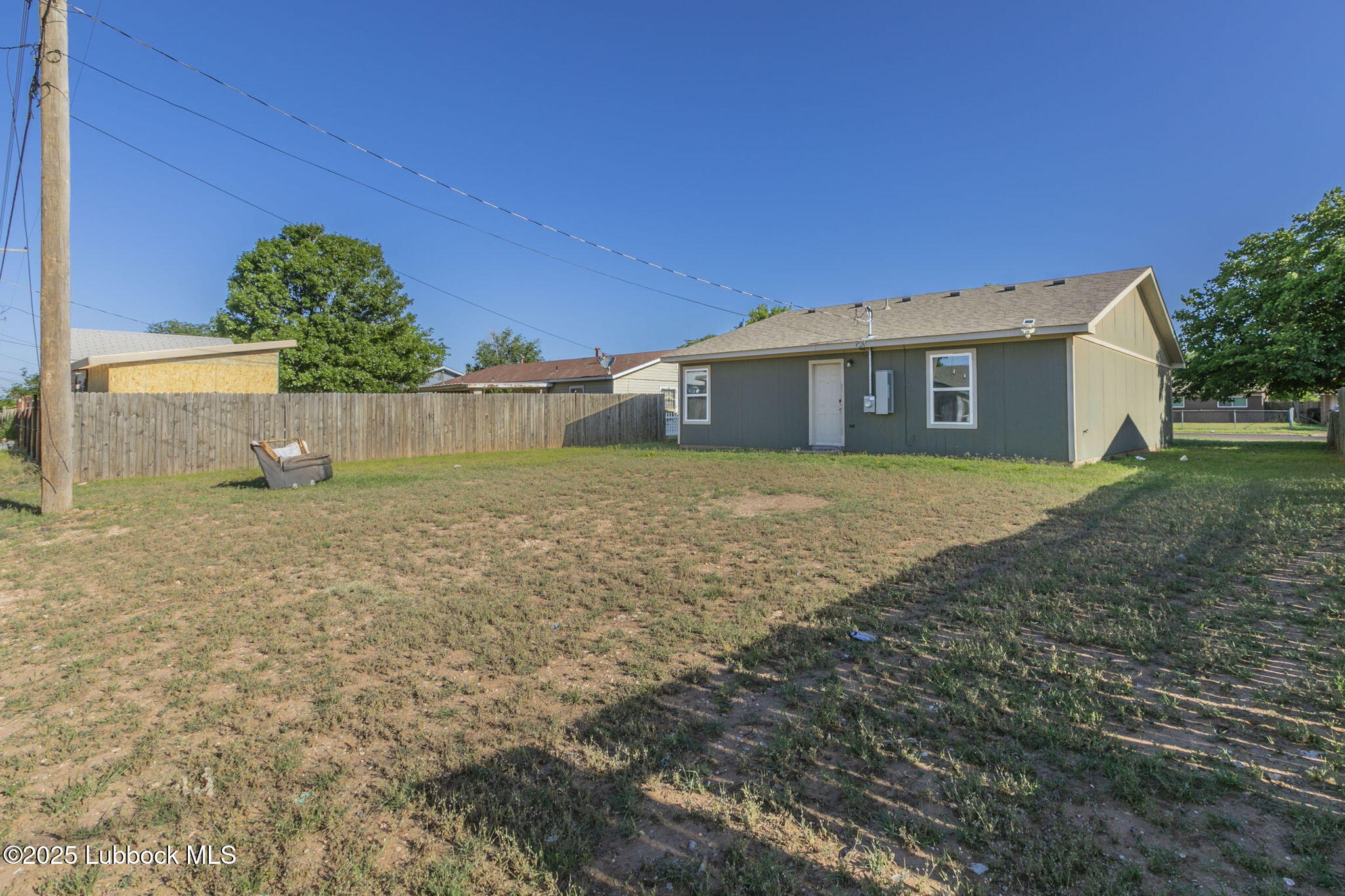 1714 East Cornell Street Lubbock, TX 79403 - Photo 18 of 18 a view of a house with a yard