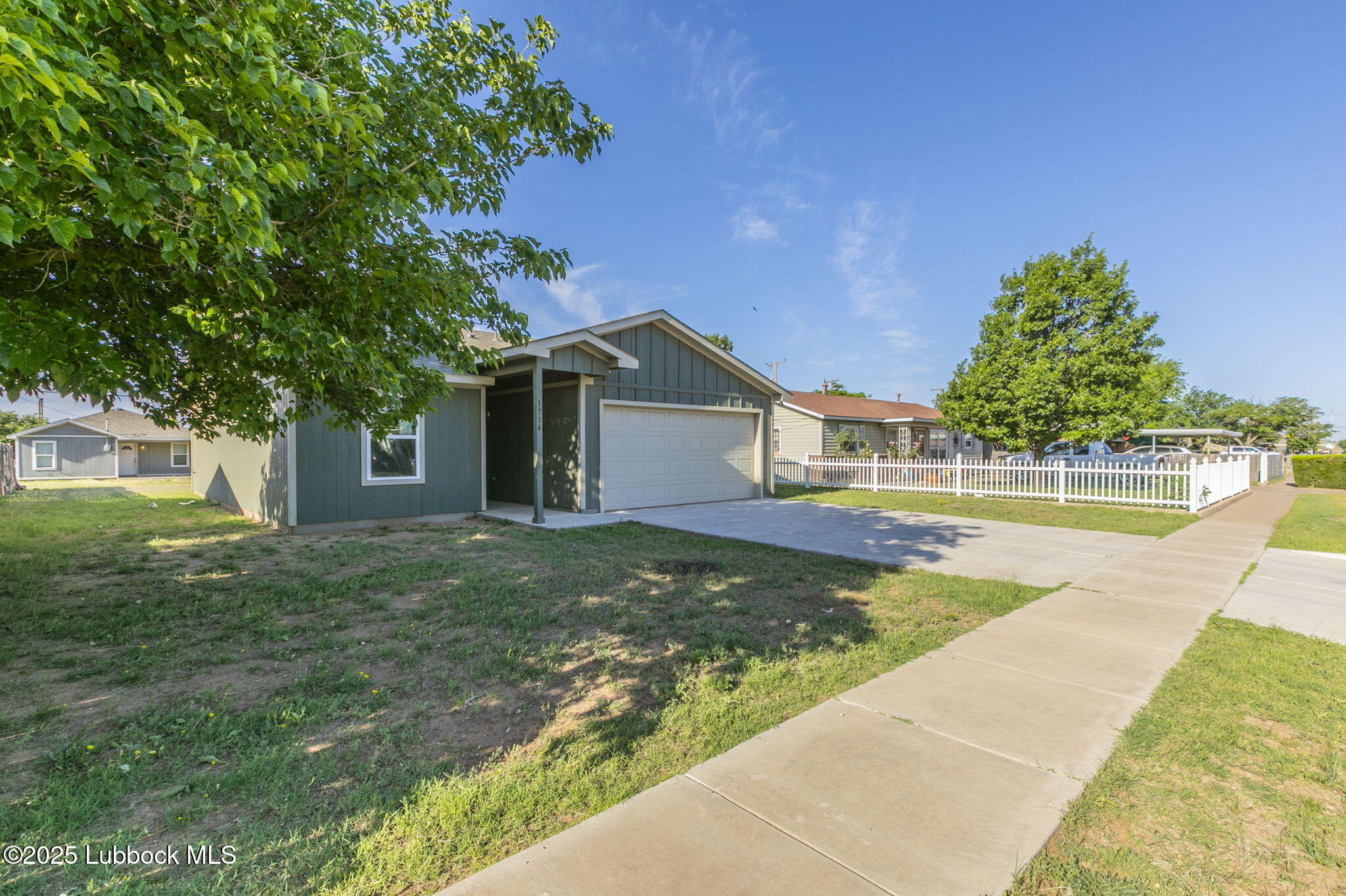 1714 East Cornell Street Lubbock, TX 79403 - Photo 2 of 18 a view of a house with pool and trees