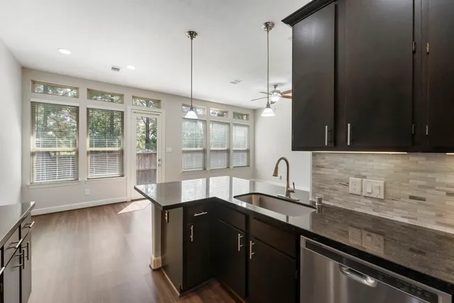 a bathroom with a glass shower door and a glass door shower