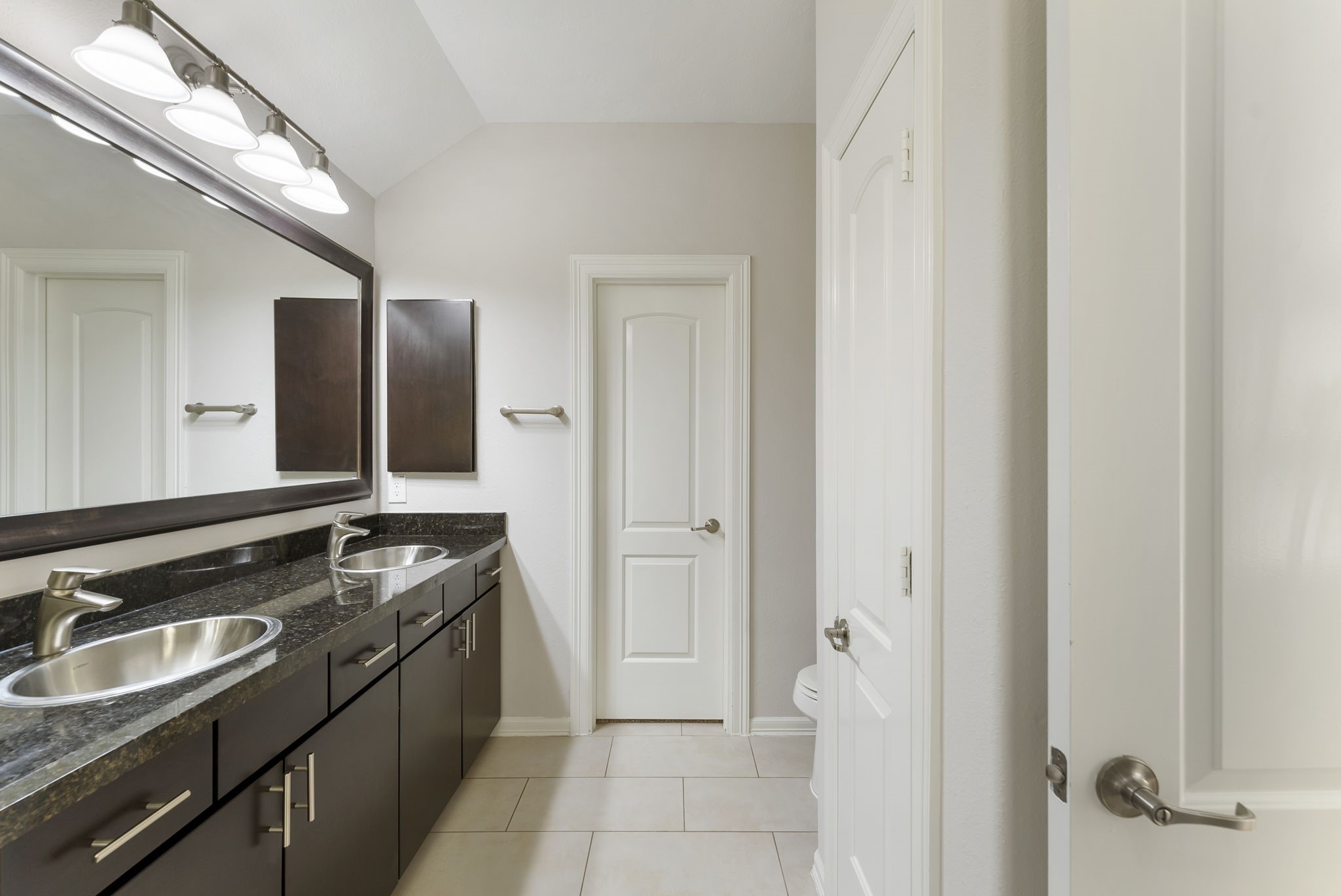 31 Aventura Place Spring, TX 77389 - Photo 31 of 49 a bathroom with a granite countertop sink and a mirror