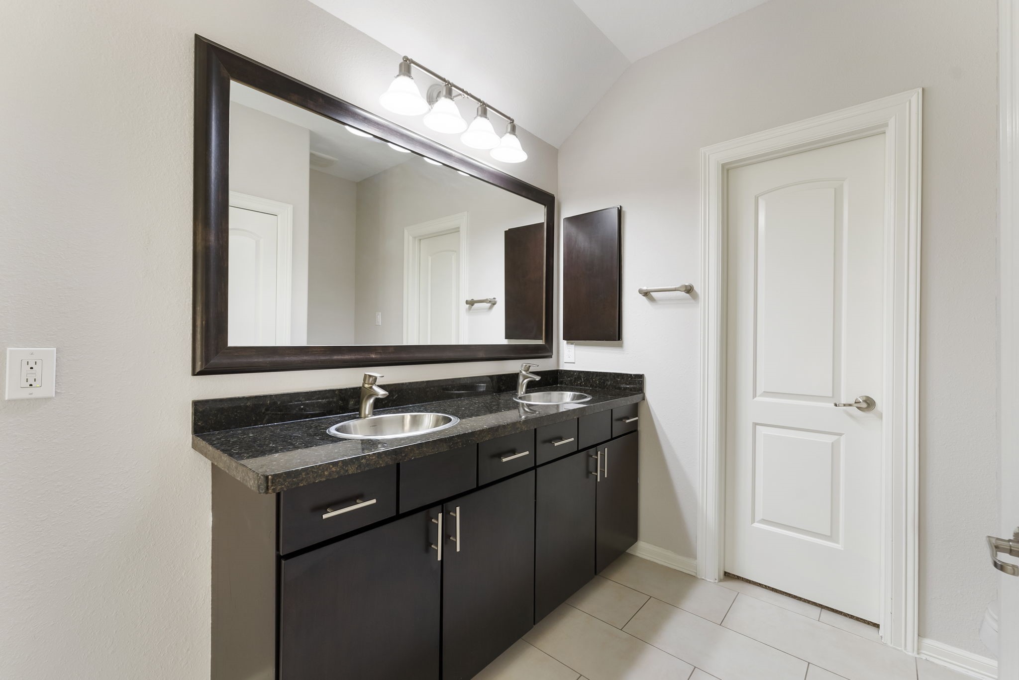 31 Aventura Place Spring, TX 77389 - Photo 34 of 49 a bathroom with a granite countertop sink and a mirror