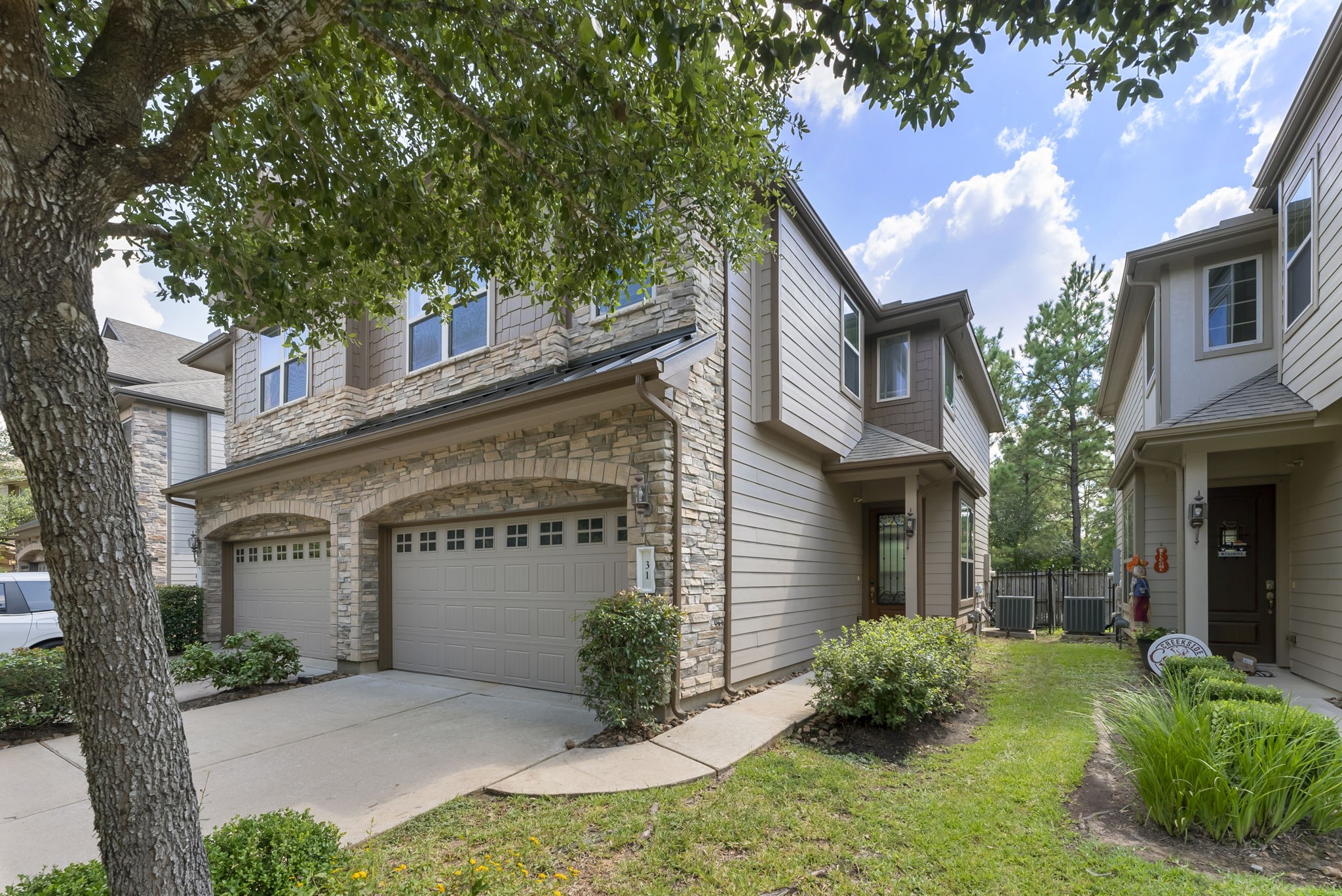 31 Aventura Place Spring, TX 77389 - Photo 44 of 49 a front view of a house with garden