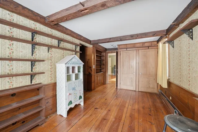 a view of entryway with wooden floor
