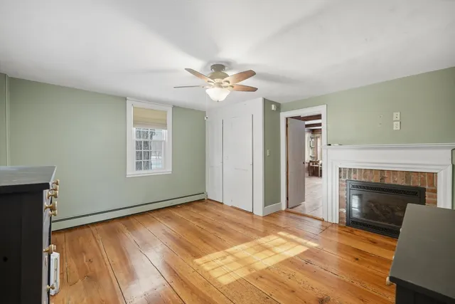 a bedroom with a bed and a fireplace