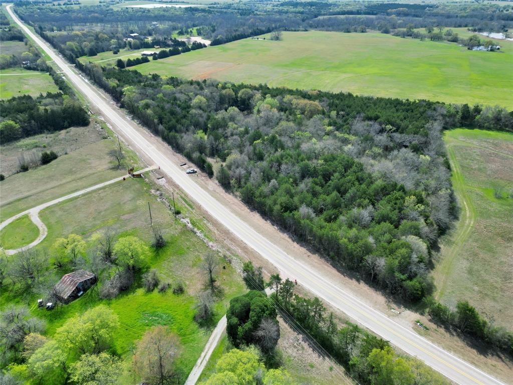 2645 St Ector Tx 75439 Bonham, TX 75418 - Photo 2 of 23 a view of a green yard with a small pool