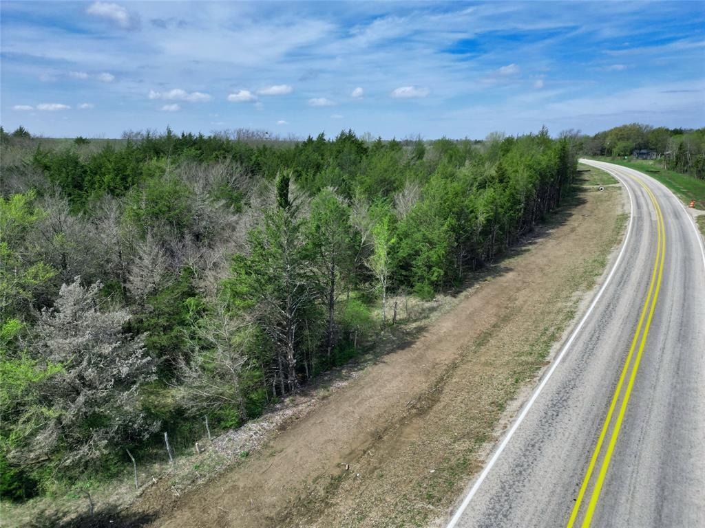 2645 St Ector Tx 75439 Bonham, TX 75418 - Photo 10 of 23 a view of a pathway both side of grassy field with shrub