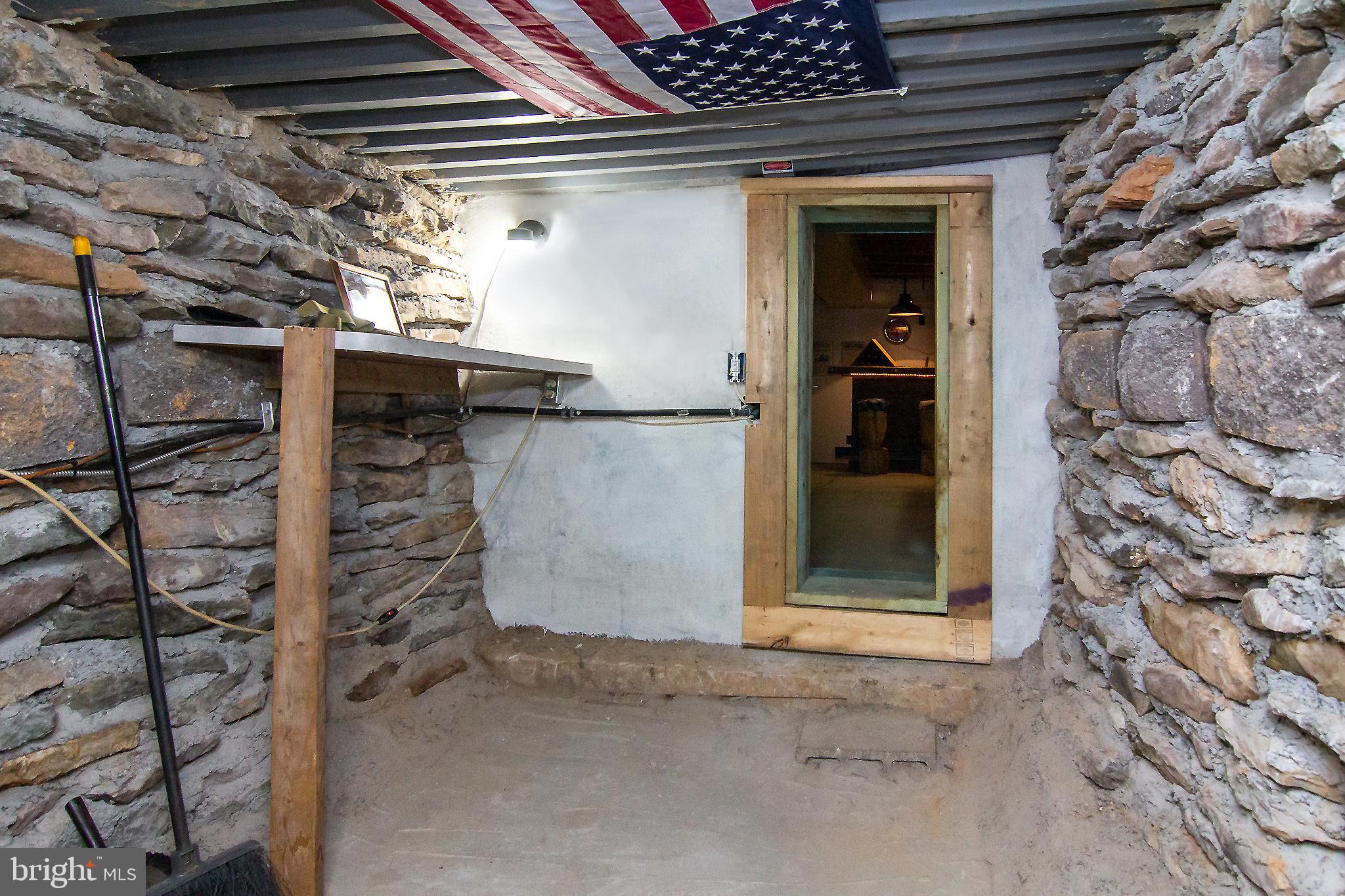 950 Green Springs Road Hanover, PA 17331 - Photo 36 of 42 Safe room w/ stone walls concrete & stone floor