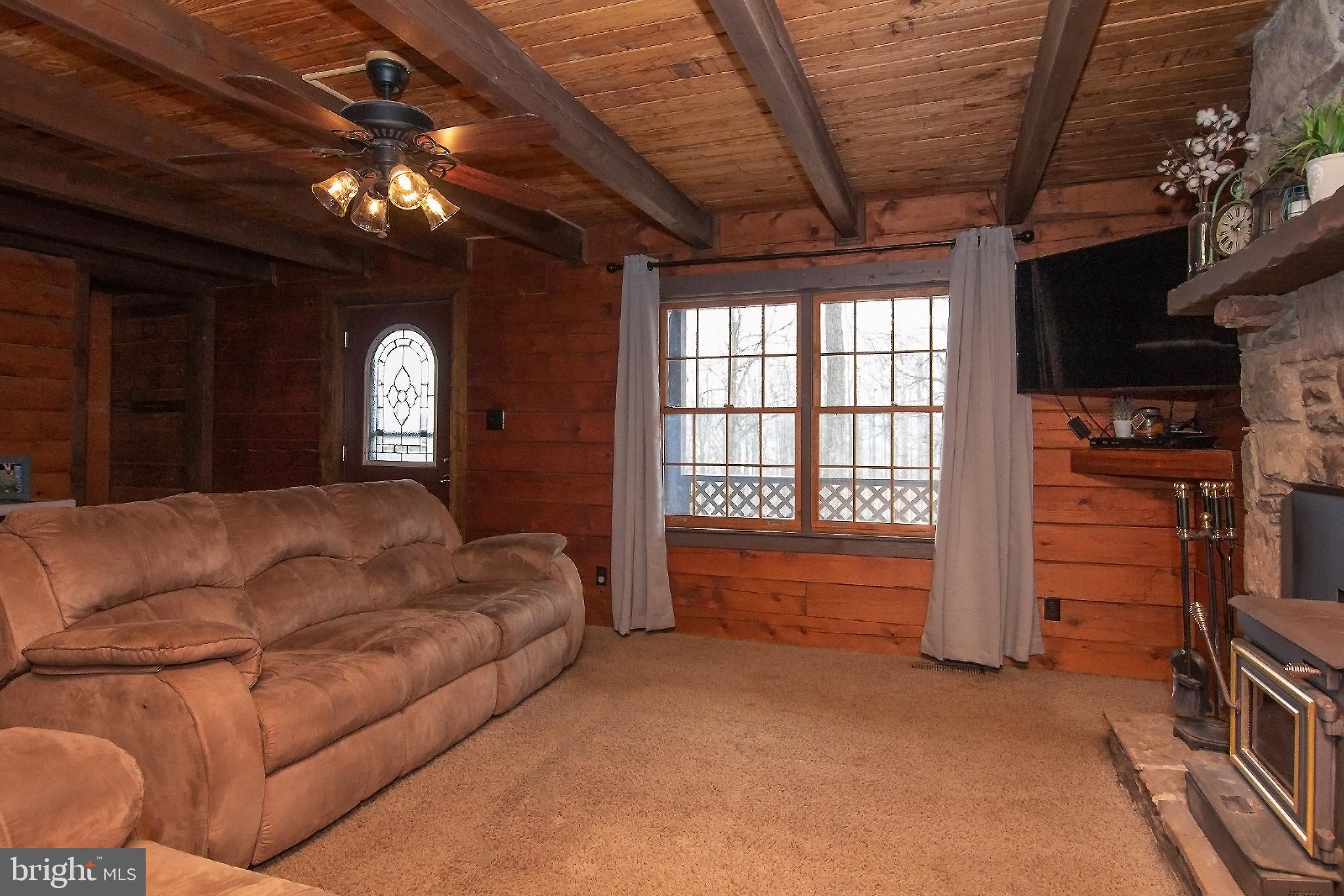 950 Green Springs Road Hanover, PA 17331 - Photo 7 of 42 Living room w/ stone fireplace & wood stove insert