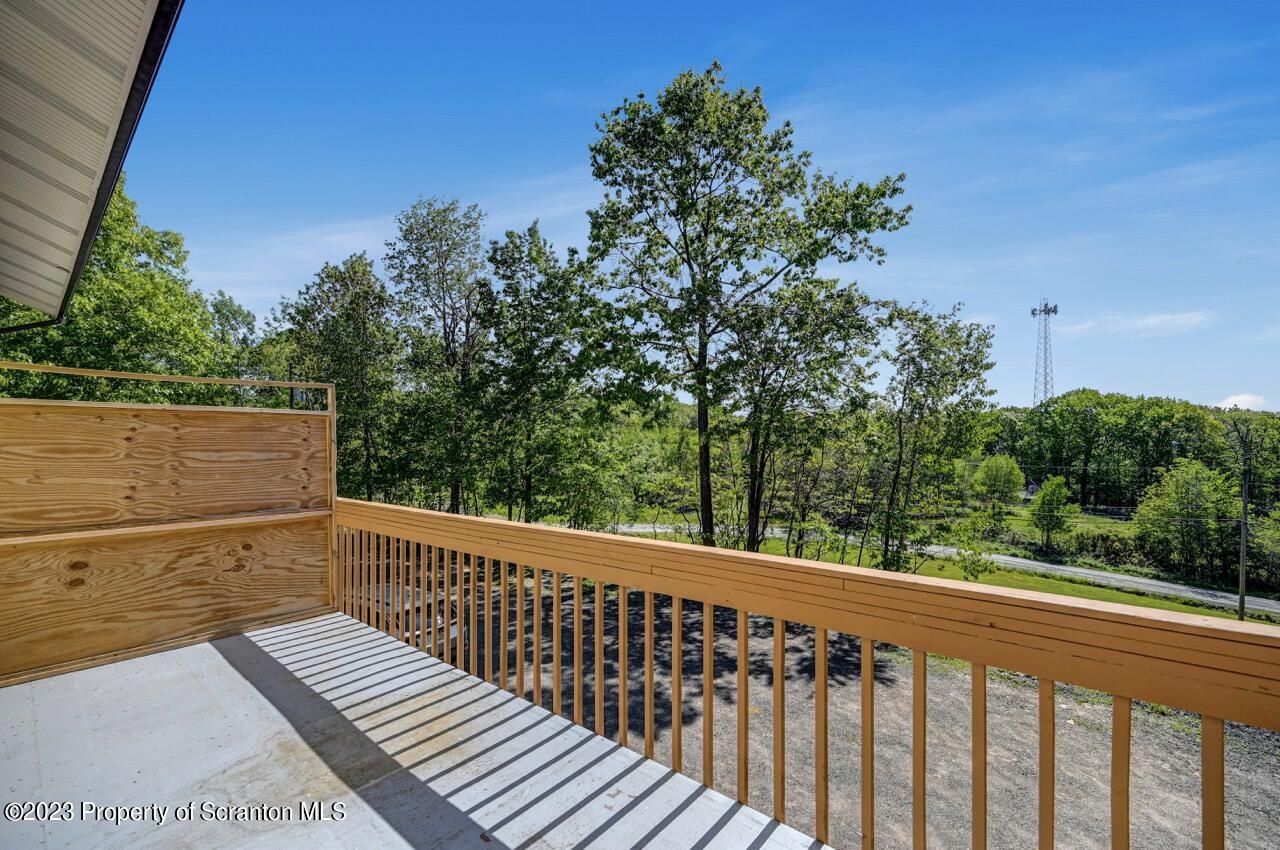 51 Butler Hill Road Lake Ariel, PA 18436 - Photo 16 of 33 a view of a balcony with wooden floor and fence