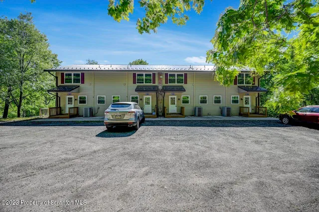 a car parked in front of a house