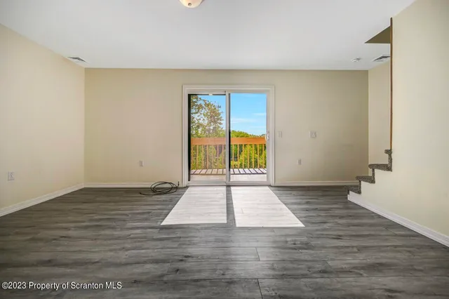 a view of an empty room and window