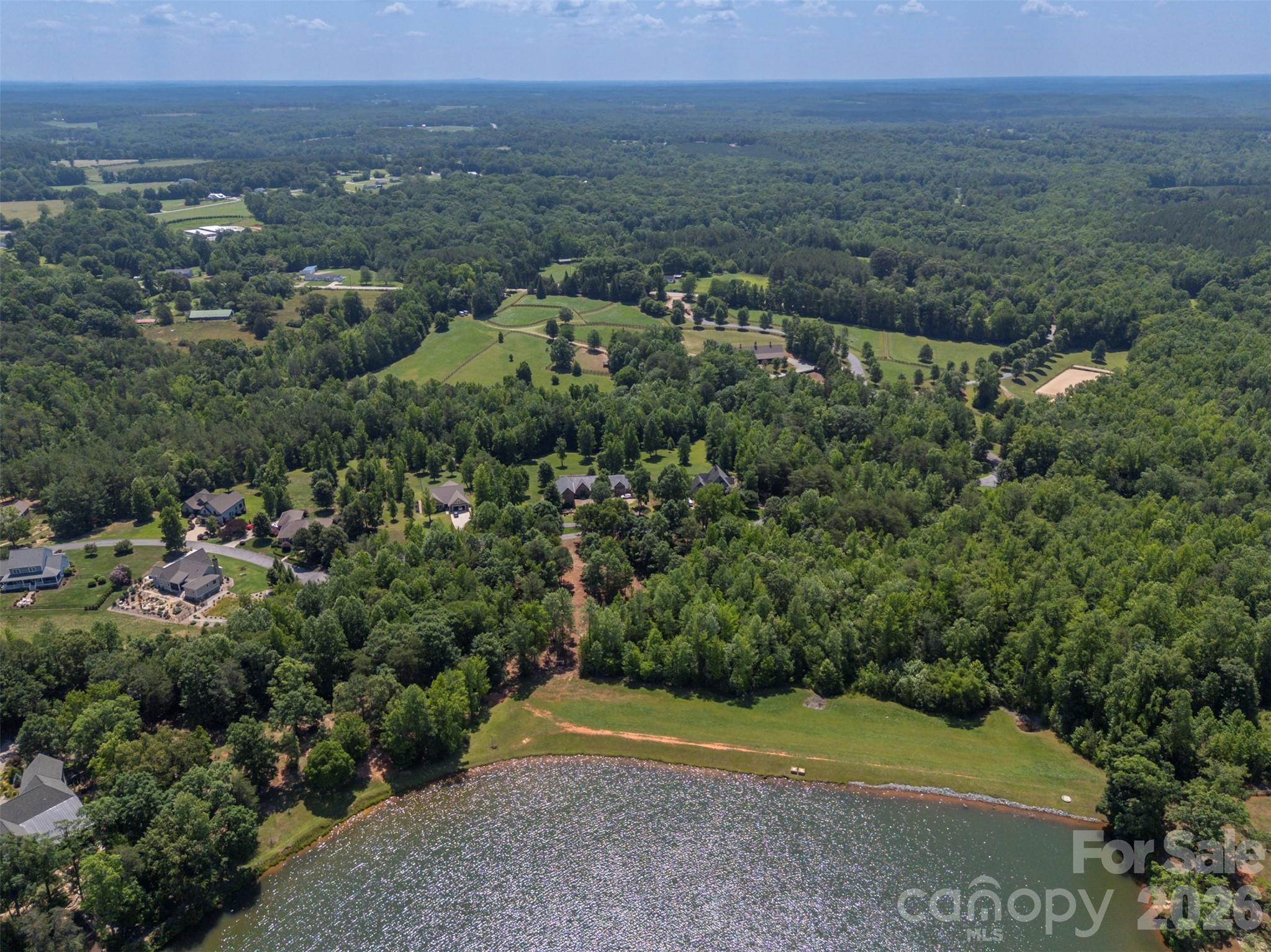 0 Doveridge Drive, Unit 66 Tryon, NC 28782 - Photo 6 of 21 an aerial view of a houses with a yard and trees