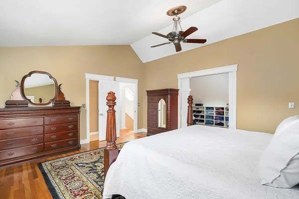 a bathroom with a sink vanity tub and a mirror