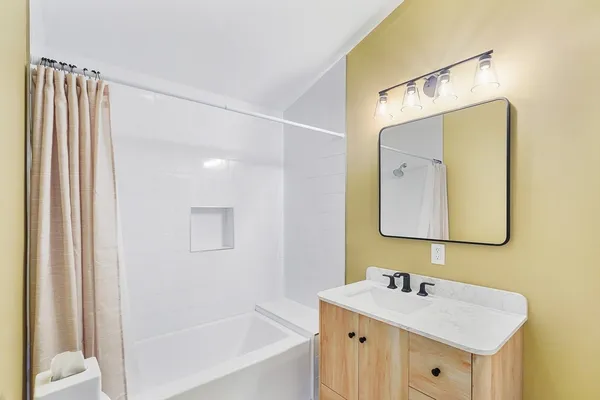 a kitchen with granite countertop a stove and a sink