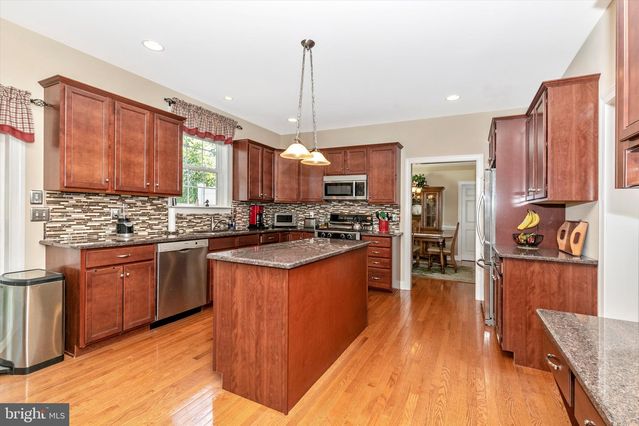 484 Hopewell Road Downingtown, PA 19335 - Photo 2 of 112 Kitchen island with pendant lighting
