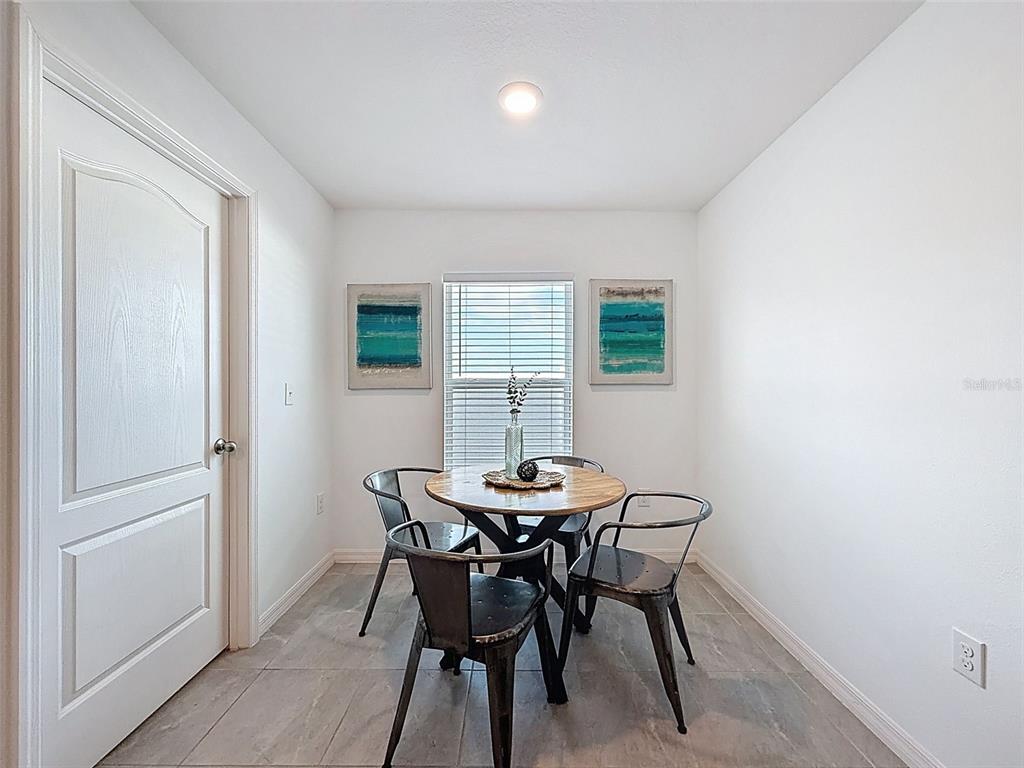12943 Impatiens Street Spring Hill, FL 34609 - Photo 13 of 53 a dining room with furniture and window
