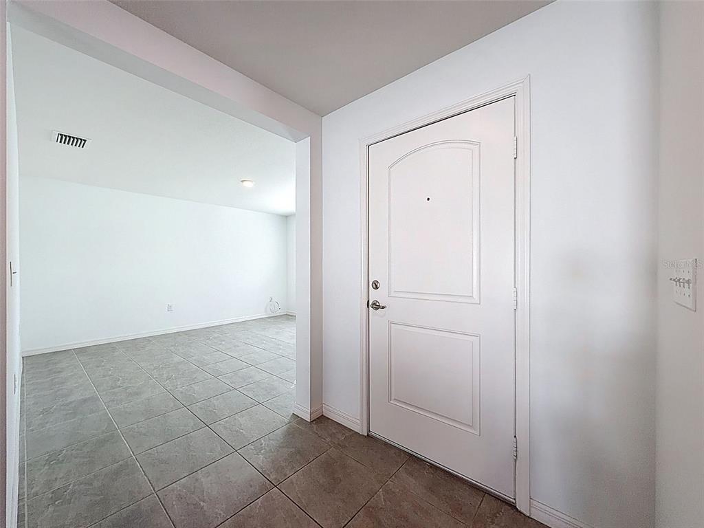 12943 Impatiens Street Spring Hill, FL 34609 - Photo 15 of 53 a view of an empty room