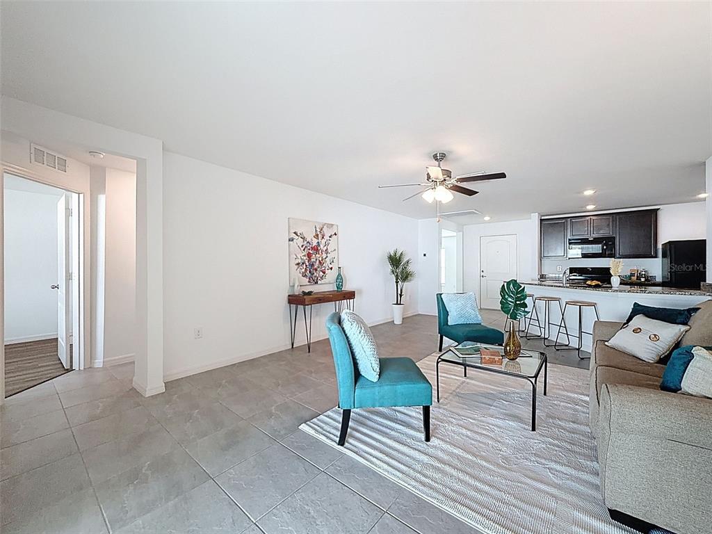 12943 Impatiens Street Spring Hill, FL 34609 - Photo 20 of 53 a living room with furniture and kitchen view
