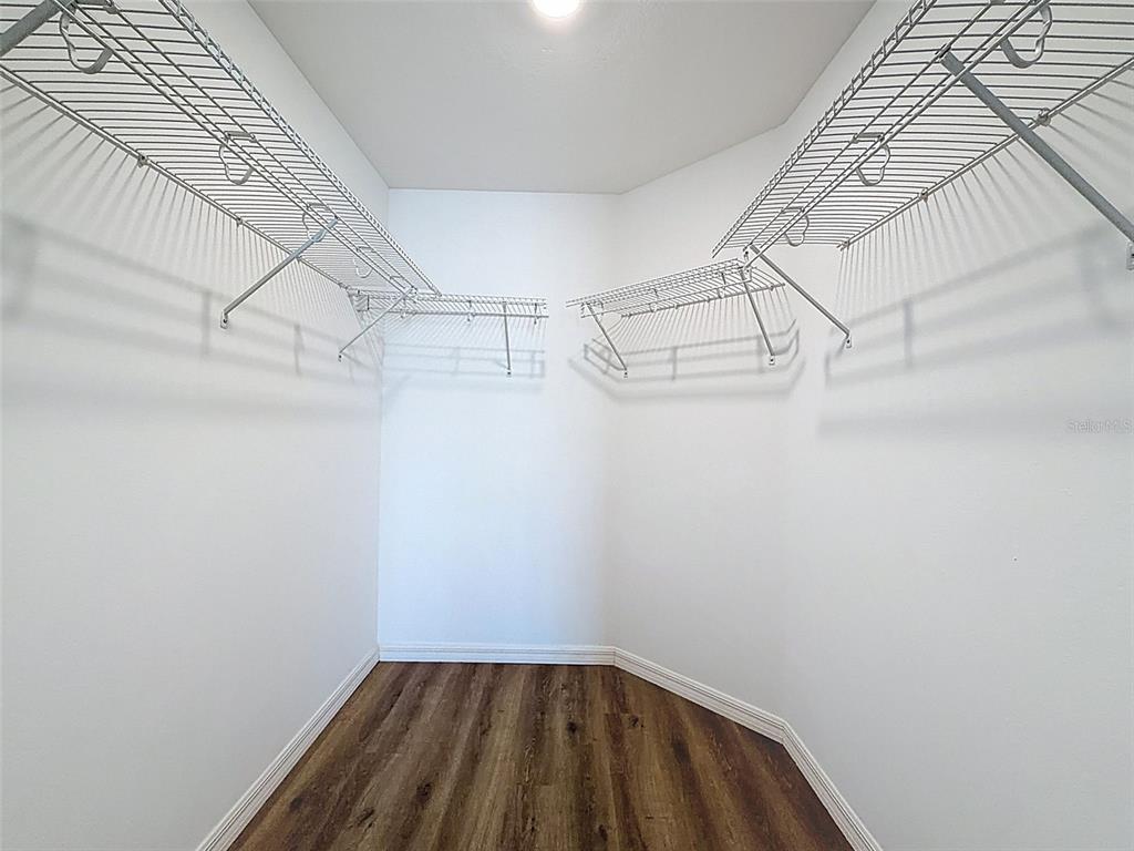 12943 Impatiens Street Spring Hill, FL 34609 - Photo 26 of 53 a view of a room with racks on the wall