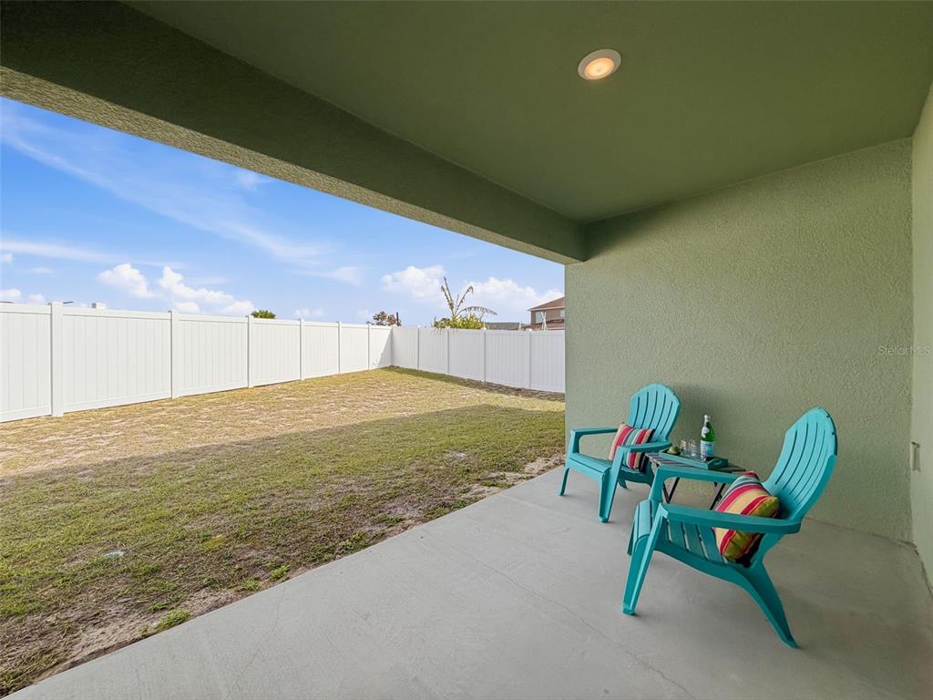 12943 Impatiens Street Spring Hill, FL 34609 - Photo 42 of 53 a room with table chairs and potted plants