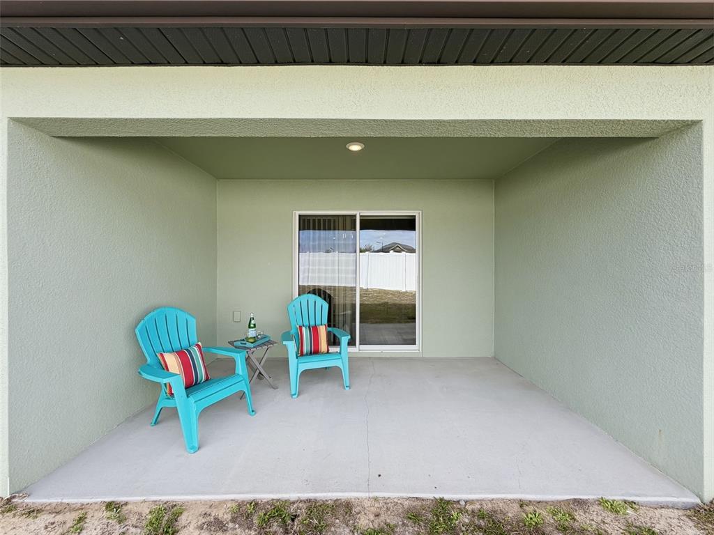 12943 Impatiens Street Spring Hill, FL 34609 - Photo 43 of 53 a living room with a couch and a table