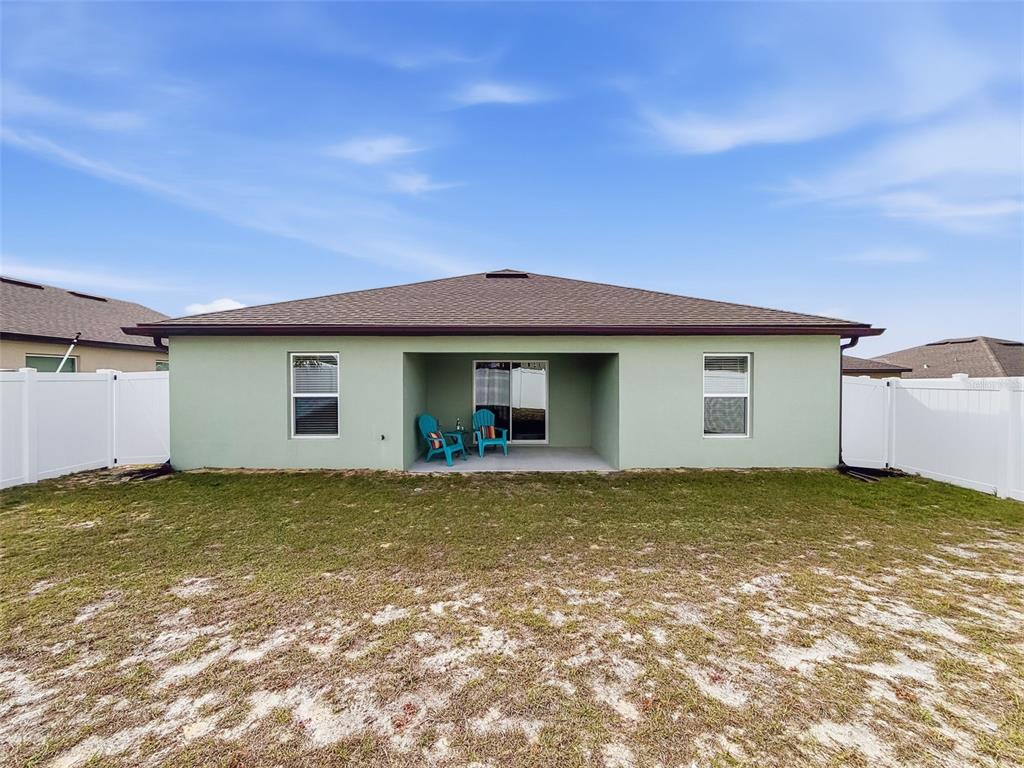 12943 Impatiens Street Spring Hill, FL 34609 - Photo 45 of 53 a view of a house with a garden