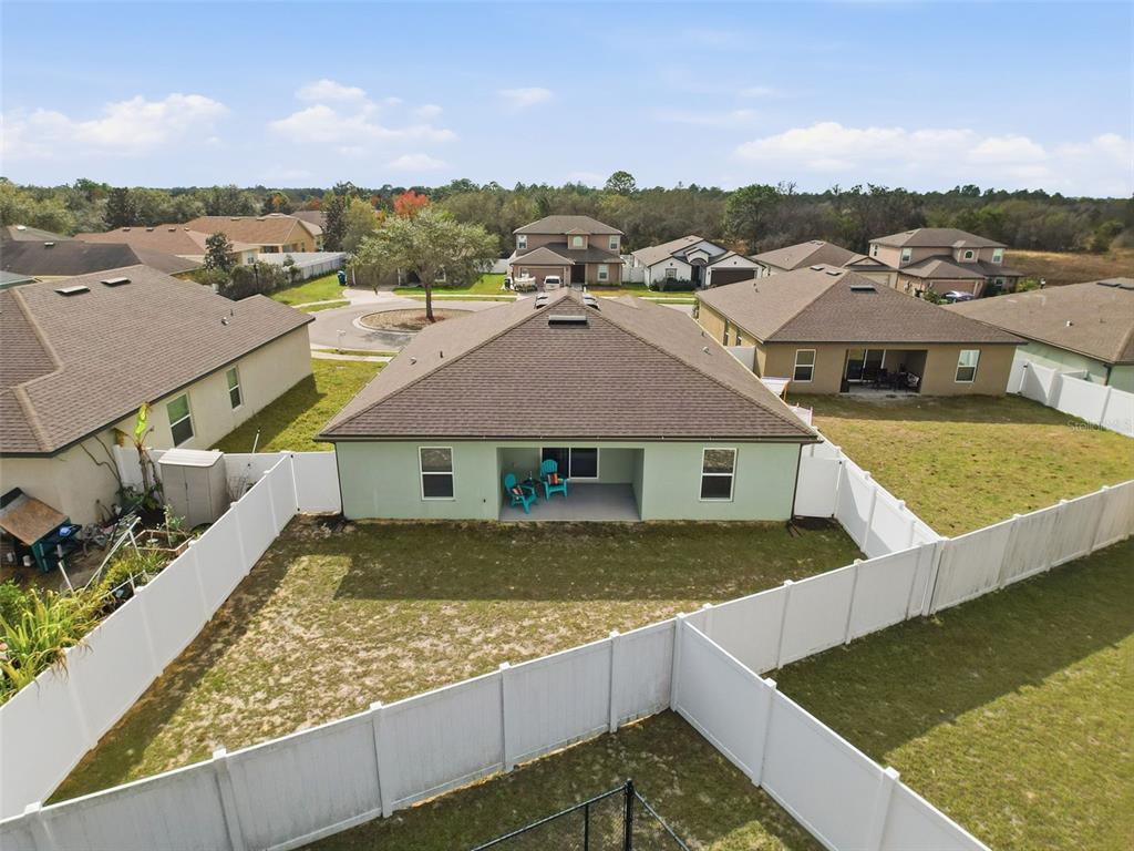 12943 Impatiens Street Spring Hill, FL 34609 - Photo 47 of 53 an aerial view of residential houses with yard