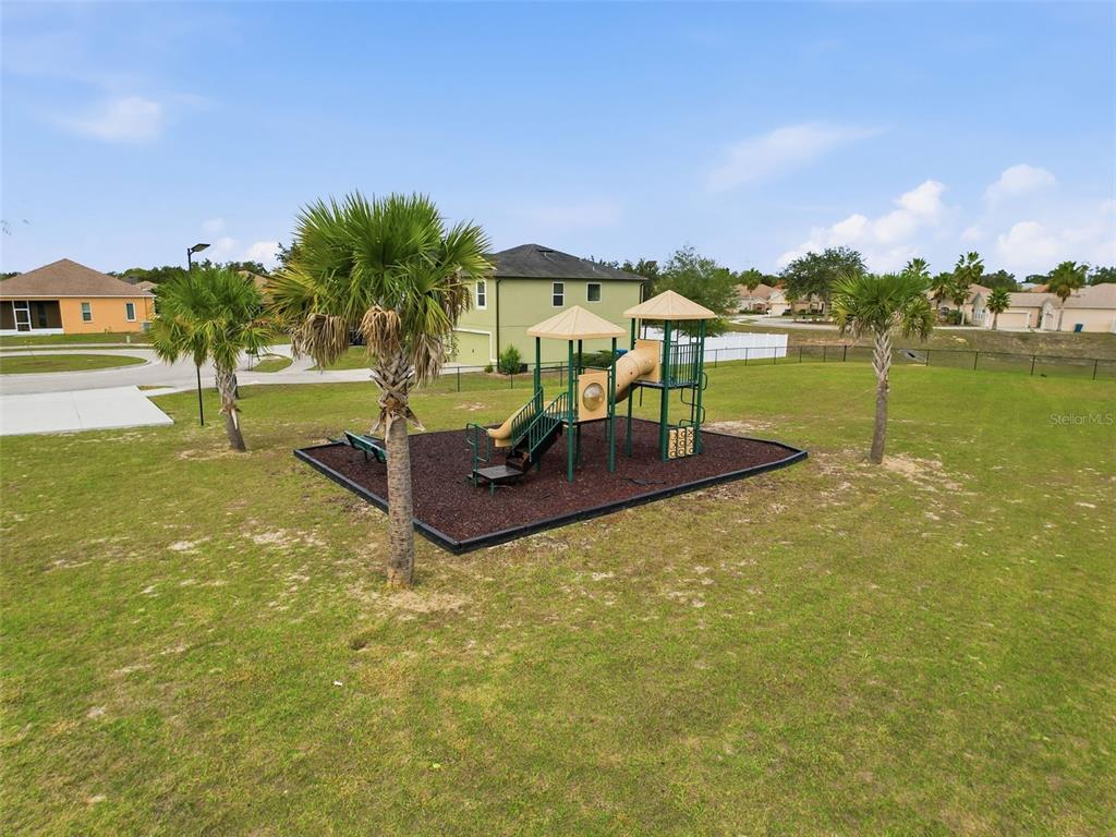 12943 Impatiens Street Spring Hill, FL 34609 - Photo 49 of 53 a view of a swimming pool with a patio