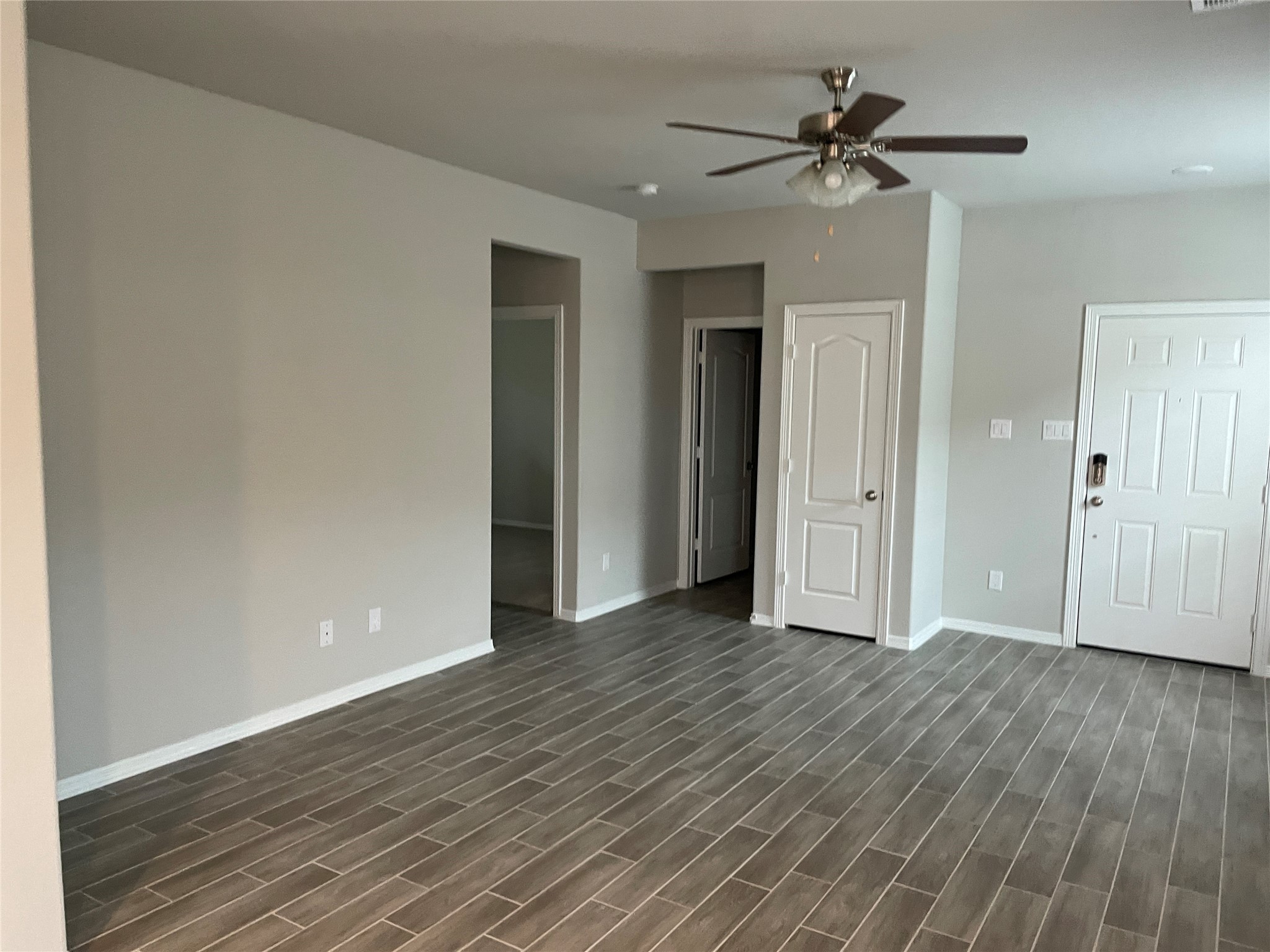 827 Redinger Ridge Drive Huffman, TX 77336 - Photo 2 of 16 a view of an empty room with wooden floor