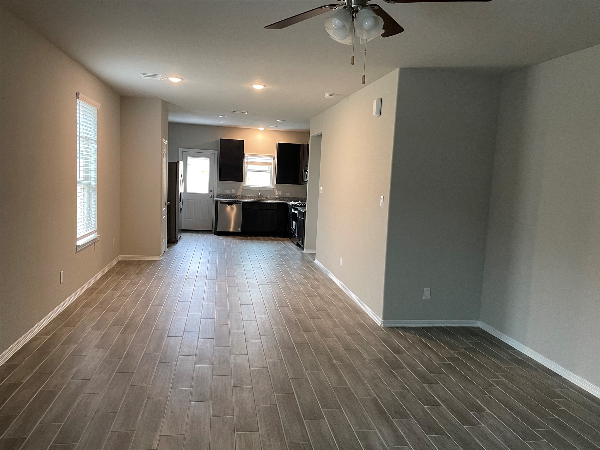 827 Redinger Ridge Drive Huffman, TX 77336 - Photo 4 of 16 a view of a livingroom with wooden floor