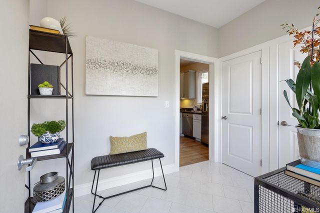 a view of an entryway with wooden floor