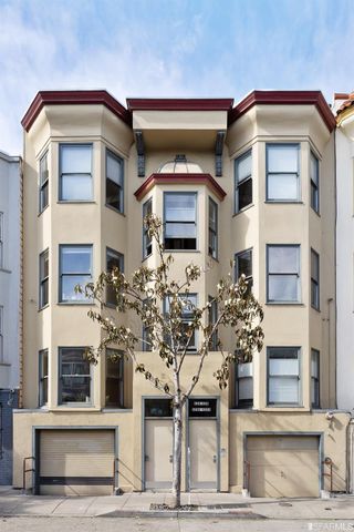 a front view of a building with many windows