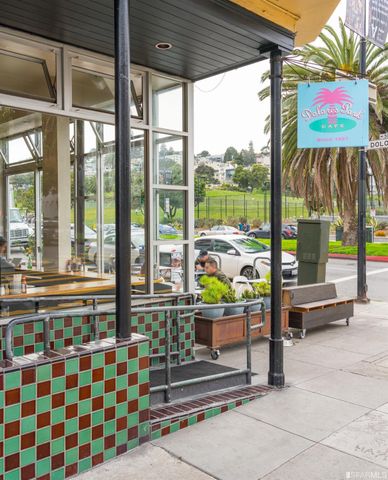 a living room with a table and chairs