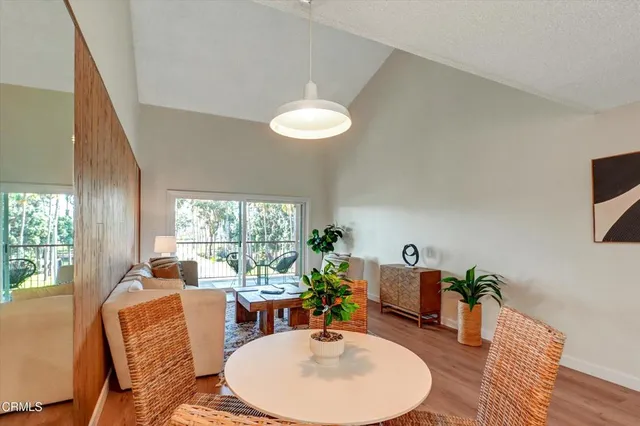 a kitchen with a refrigerator and a stove top oven