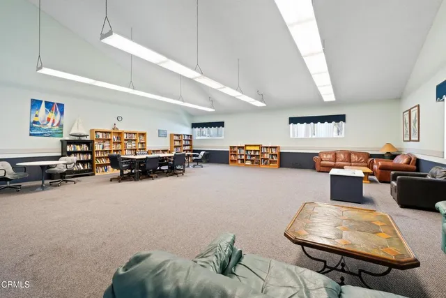 a view of a lobby with black carpet