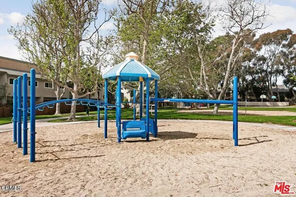 a view of a playground with basketball court
