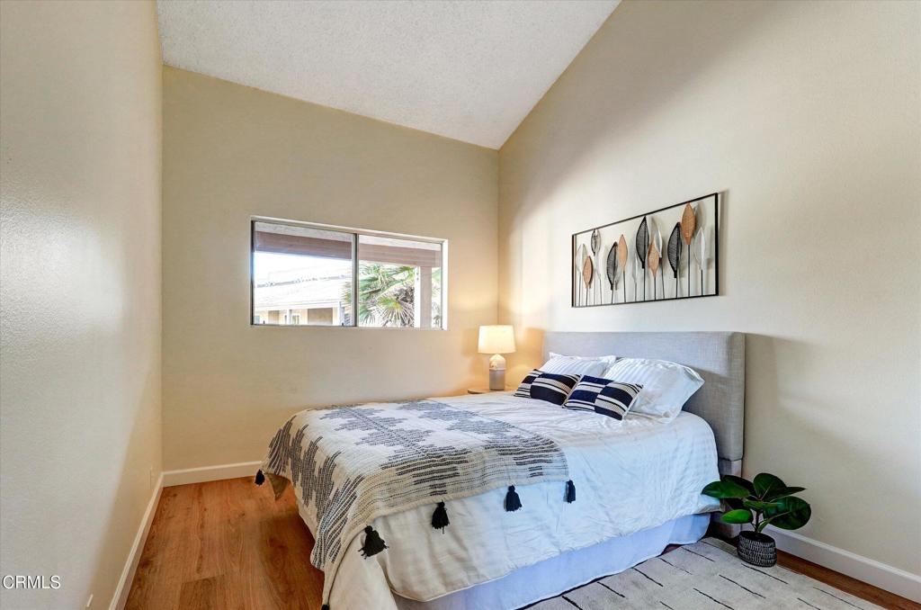 656 Sunfish Way Port Hueneme, CA 93041 - Photo 6 of 52 a bedroom with a bed and wooden floor