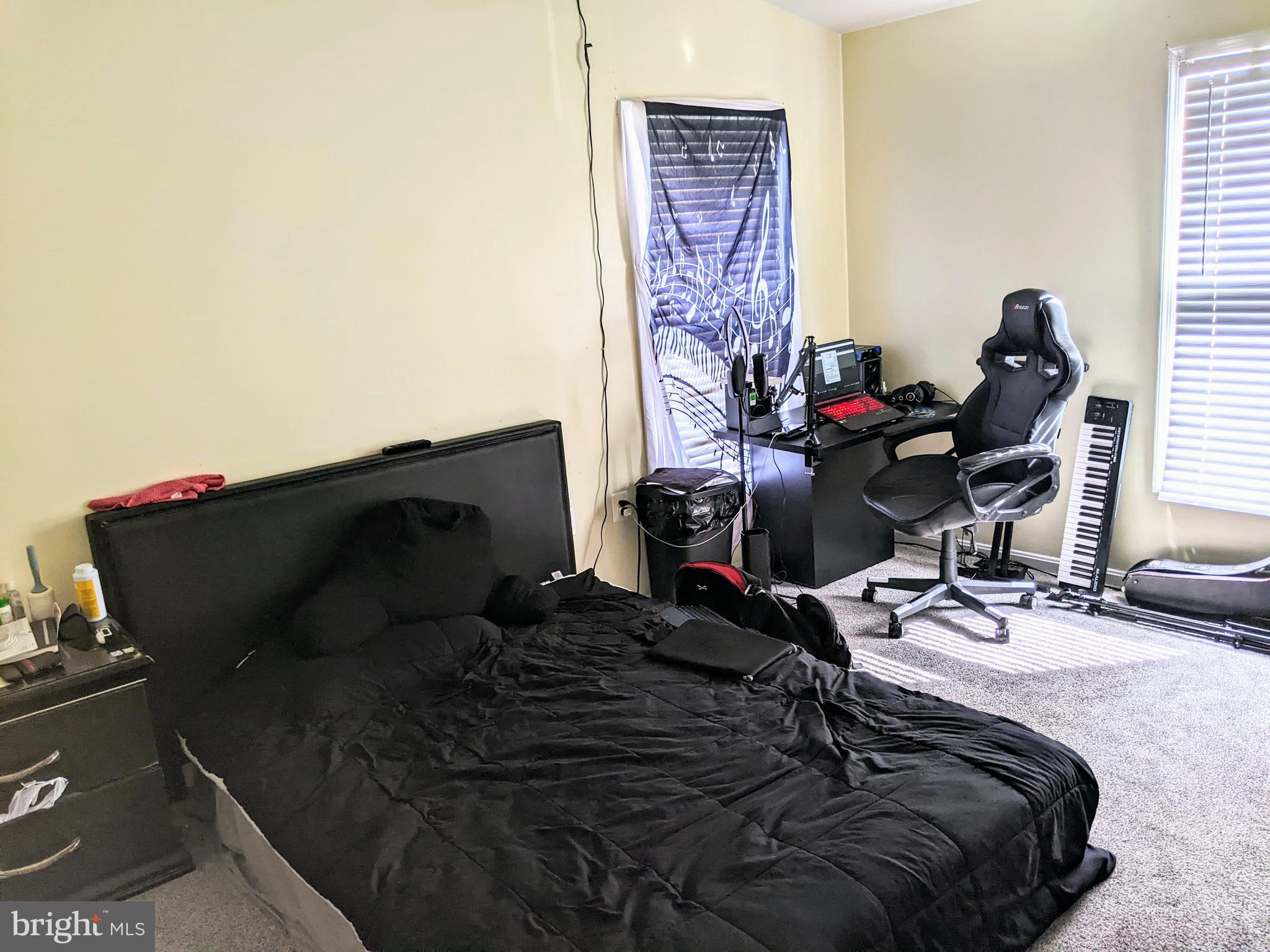 7372 Rokeby Drive Manassas, VA 20109 - Photo 11 of 21 a bedroom with a bed and two windows