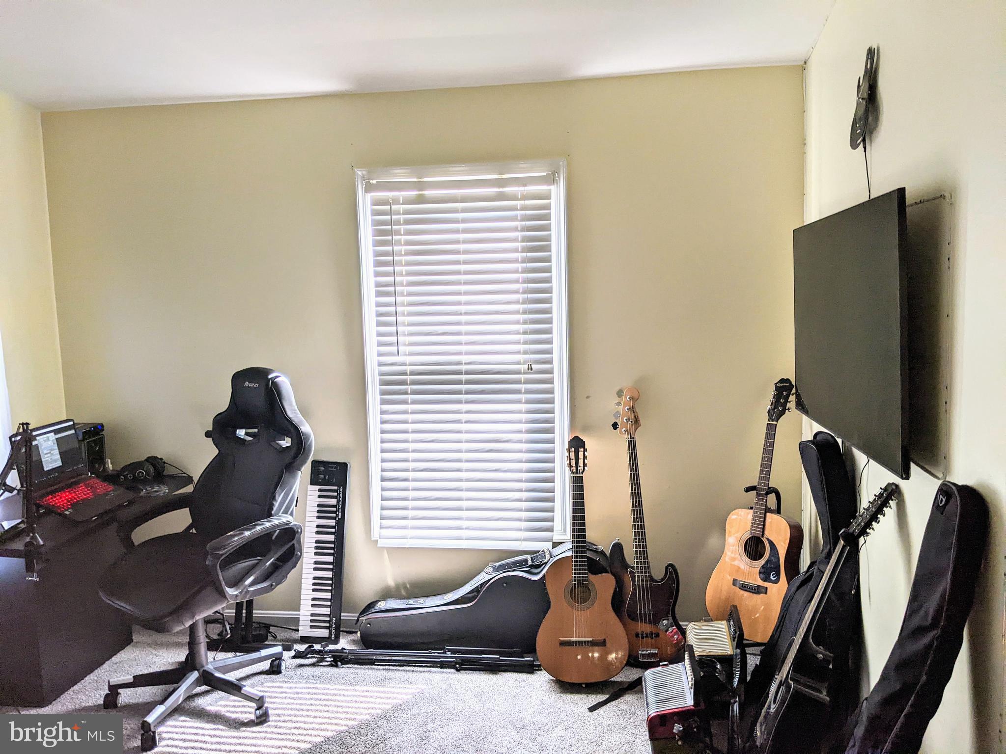 7372 Rokeby Drive Manassas, VA 20109 - Photo 12 of 21 a room with gym equipment and a flat screen tv