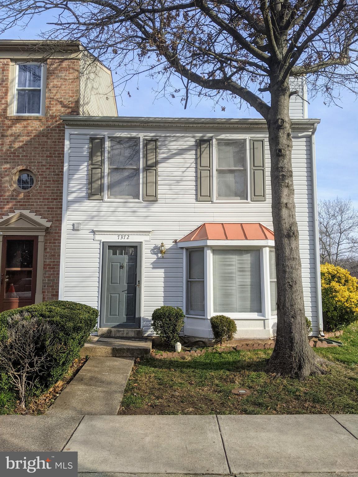 7372 Rokeby Drive Manassas, VA 20109 - Photo 2 of 21 a front view of a house with garden