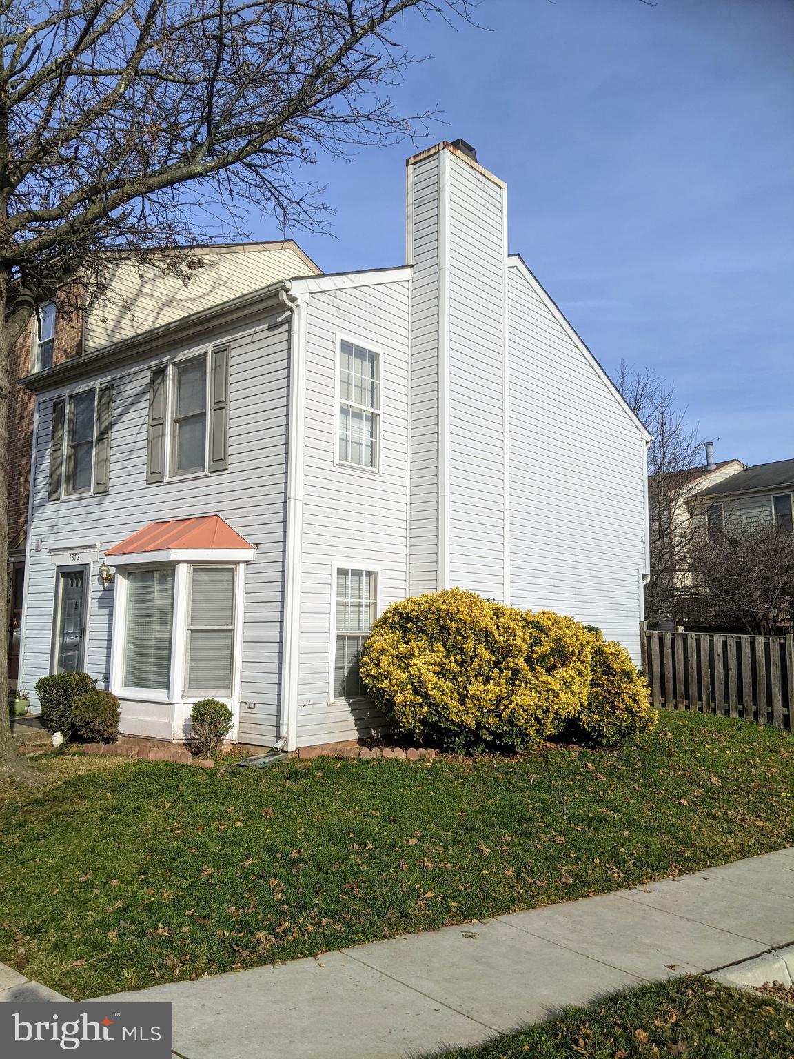 7372 Rokeby Drive Manassas, VA 20109 - Photo 3 of 21 a front view of a house with a yard