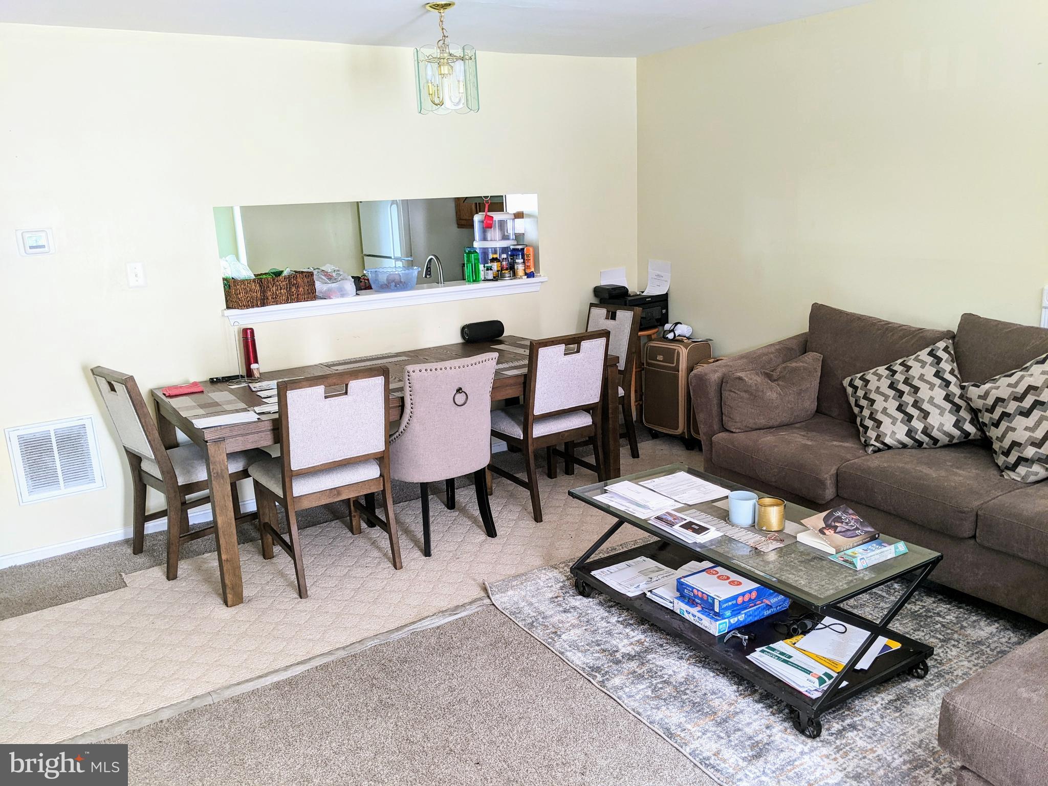 7372 Rokeby Drive Manassas, VA 20109 - Photo 7 of 21 a living room with furniture and a dining table