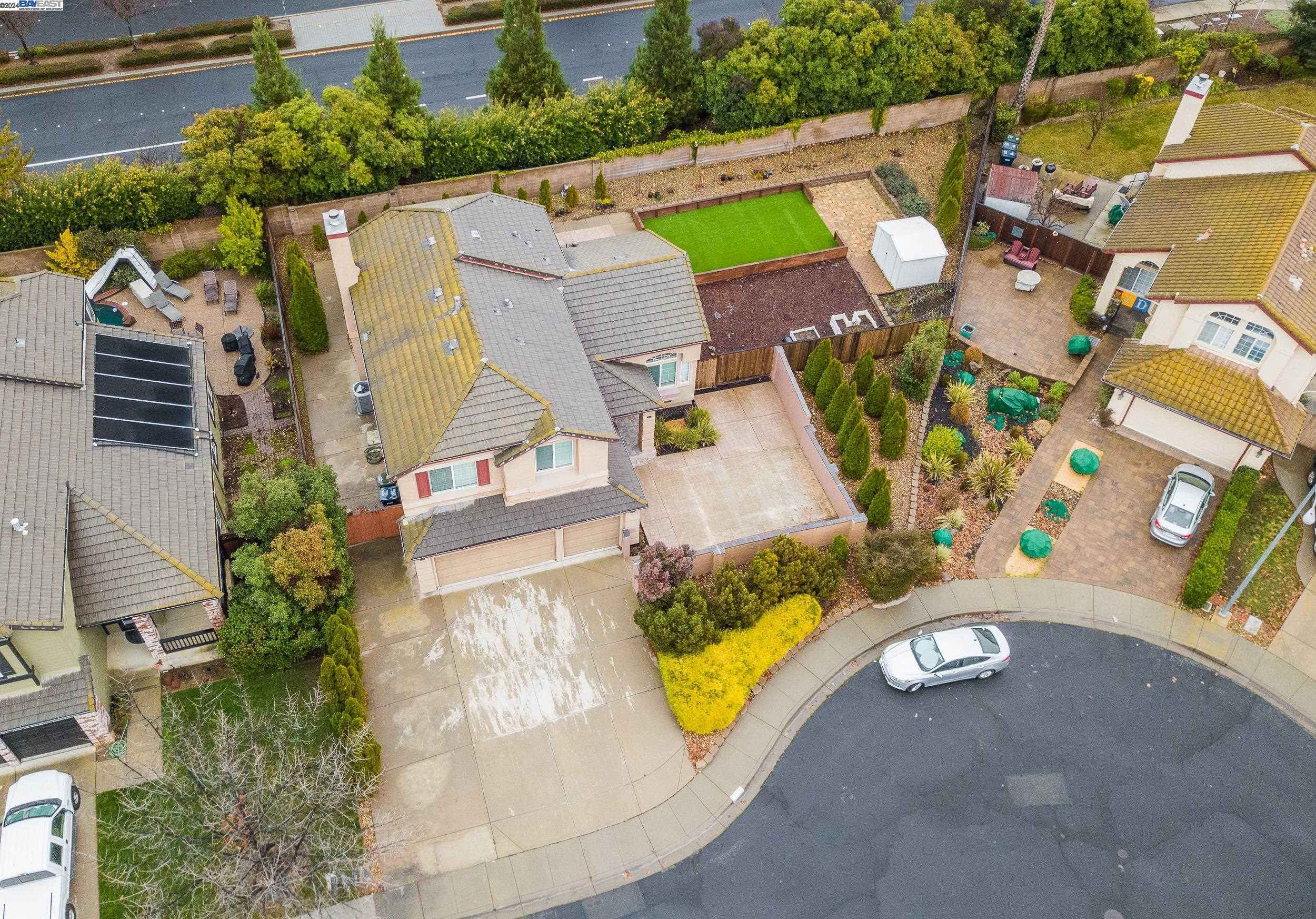 an aerial view of a house with a swimming pool